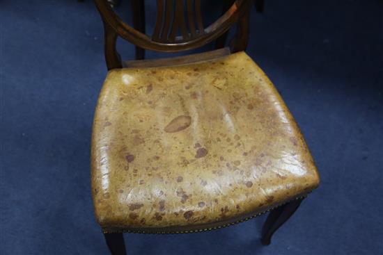 A set of twelve Hepplewhite style mahogany dining chairs